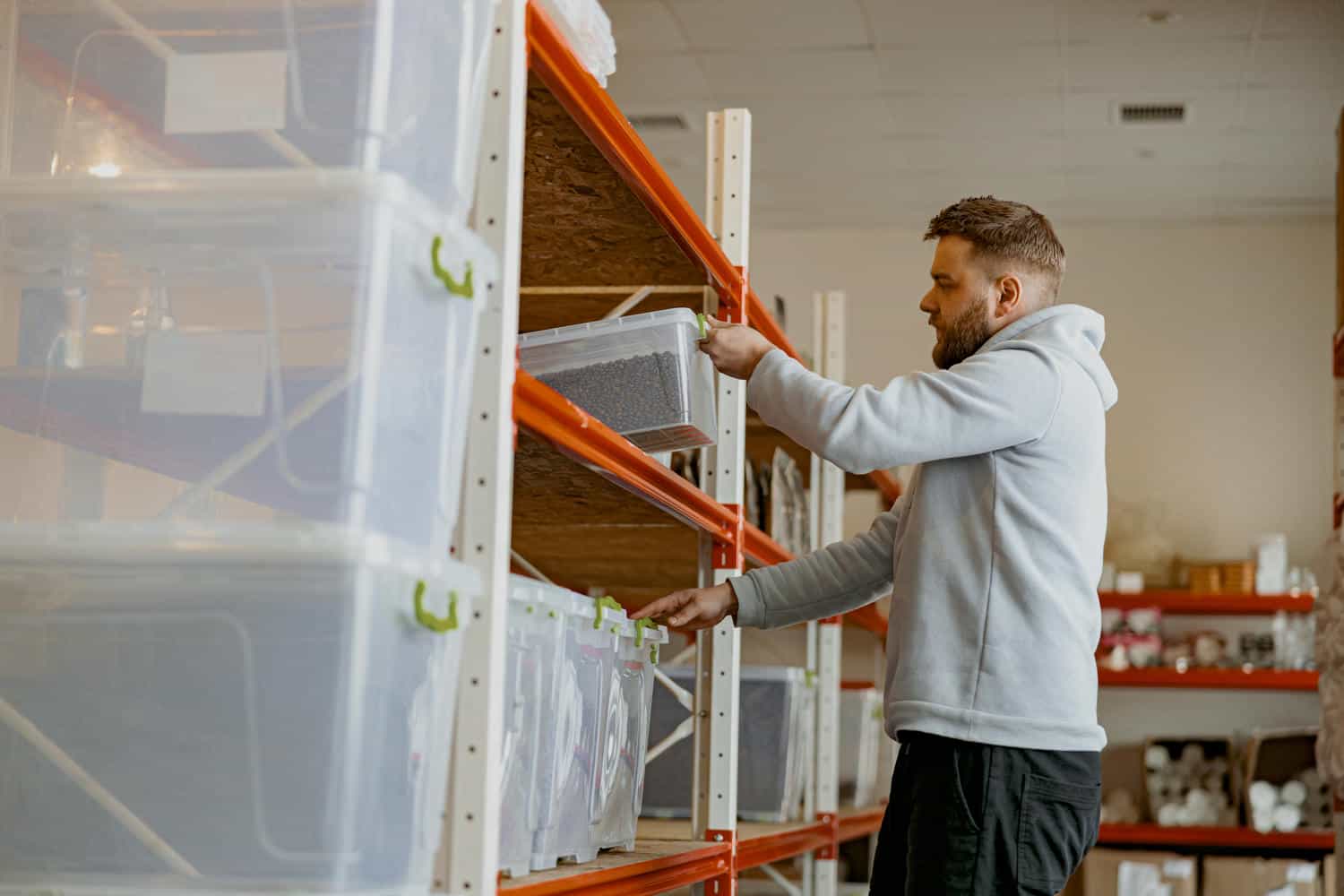 entrepreneur stacks boxes of roasted coffee beans